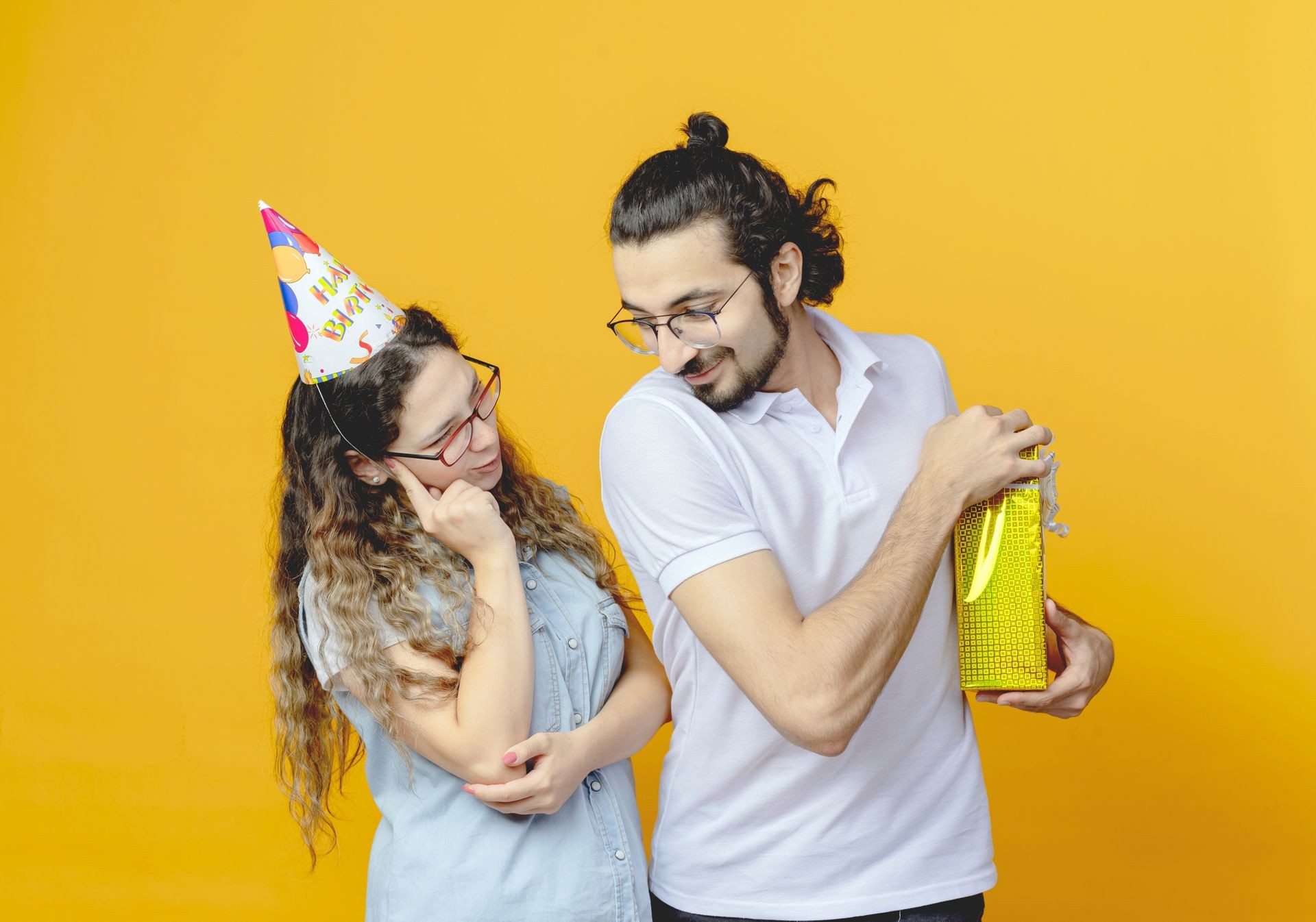 A boy and girl holding customized gift celebrating birthday