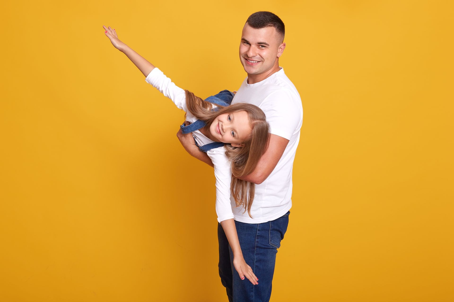 A girl and her father holding celebrating father's day